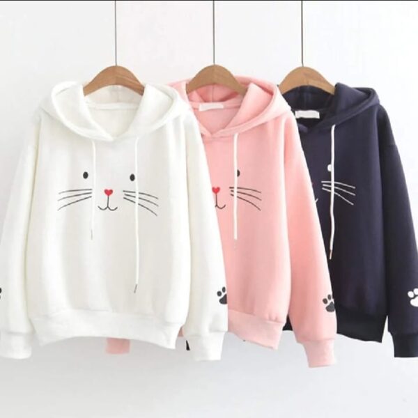 Turn heads with this adorable Pink Cat Face Hoodie, designed for comfort and cuteness. Featuring a charming cat face graphic with expressive eyes, whiskers, and a red heart-shaped nose, this hoodie brings playful energy to your everyday style.